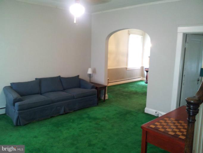 624 Stamford Road Baltimore, MD 21229 - Photo 6 of 21 a living room with a couch and a rug