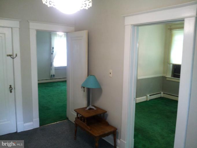 624 Stamford Road Baltimore, MD 21229 - Photo 8 of 21 a view of a room that has a bench in it