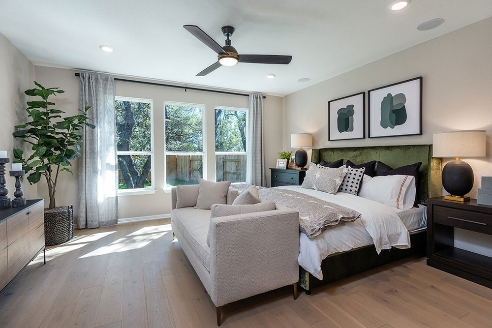 1212 Scenic Grn Loop Georgetown, TX 78628 - Photo 16 of 36 a spacious bedroom with a large bed and a large window