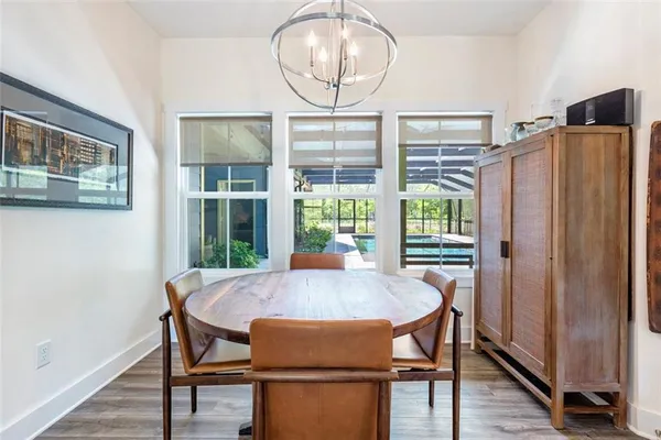 a kitchen with granite countertop white cabinets and a stove