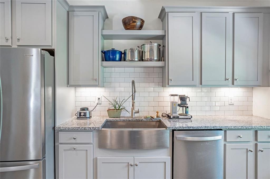 225 Hamrick Road Bremen, GA 30110 - Photo 13 of 61 a kitchen with stainless steel appliances granite countertop a sink and a refrigerator