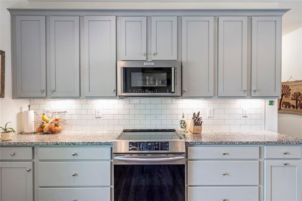 225 Hamrick Road Bremen, GA 30110 - Photo 14 of 61 a kitchen with granite countertop white cabinets and a stove