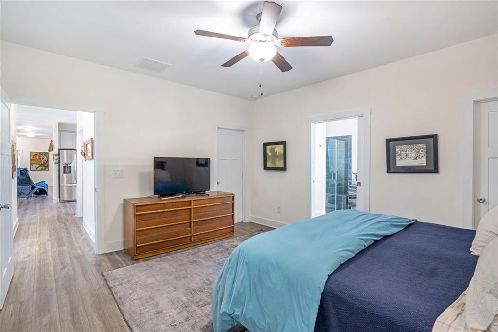 225 Hamrick Road Bremen, GA 30110 - Photo 17 of 61 a bedroom with a bed and a chandelier