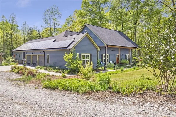 a front view of a house with outdoor seating