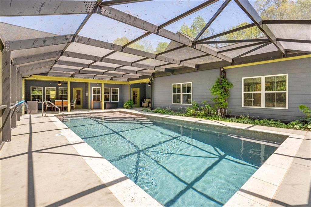 225 Hamrick Road Bremen, GA 30110 - Photo 29 of 61 a view of a patio with a table and chairs under an umbrella