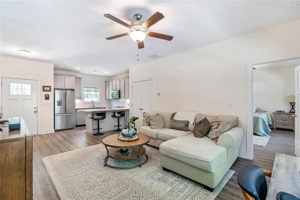 a bedroom with furniture and flat screen tv