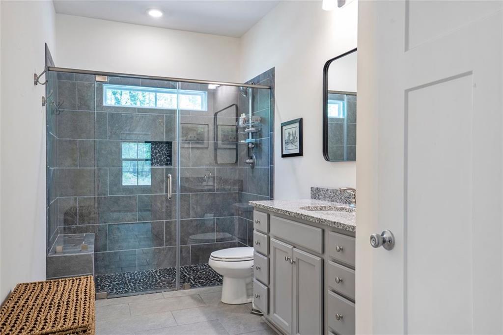 225 Hamrick Road Bremen, GA 30110 - Photo 43 of 61 a bathroom with a toilet a sink and shower
