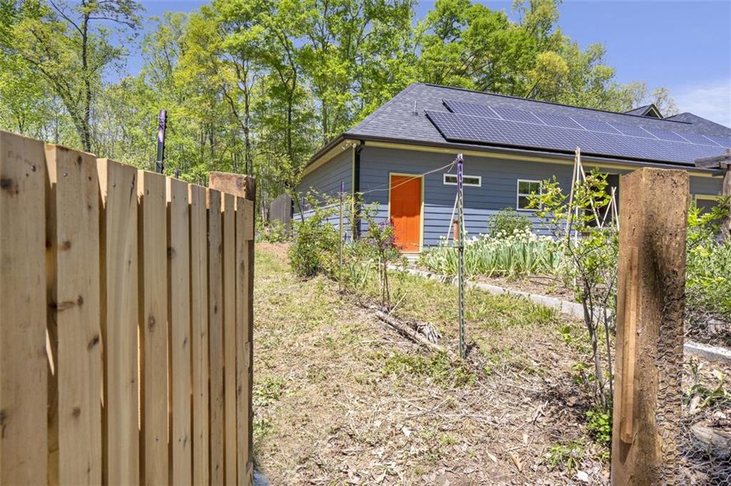 225 Hamrick Road Bremen, GA 30110 - Photo 52 of 61 a view of a house with a small yard and a large tree