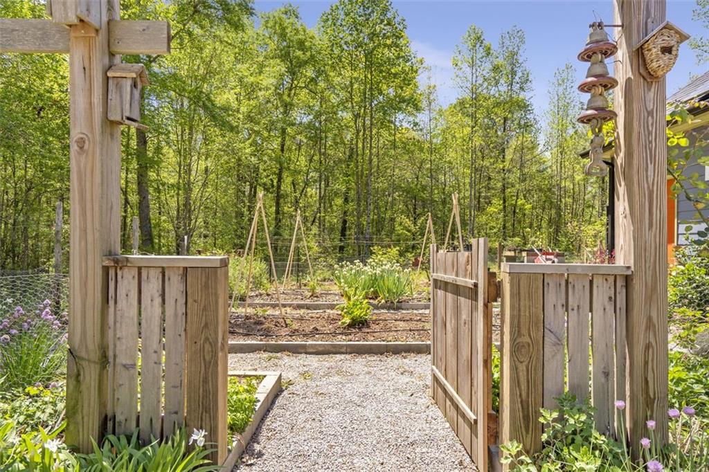 225 Hamrick Road Bremen, GA 30110 - Photo 56 of 61 a view of a pathway of a garden with wooden fence