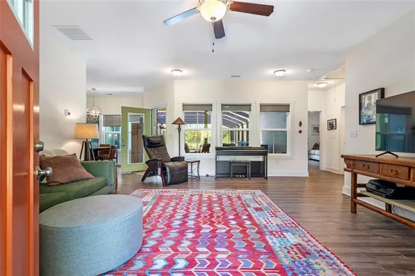 a living room with furniture and a rug