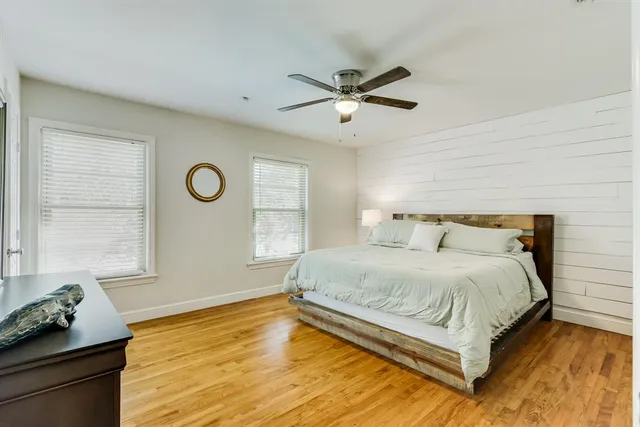 a bedroom with a bed and window