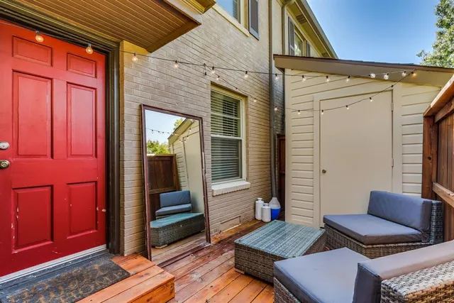 a view of living room filled with furniture and wooden floor