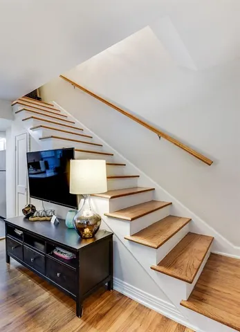 a living room with furniture and a night stand
