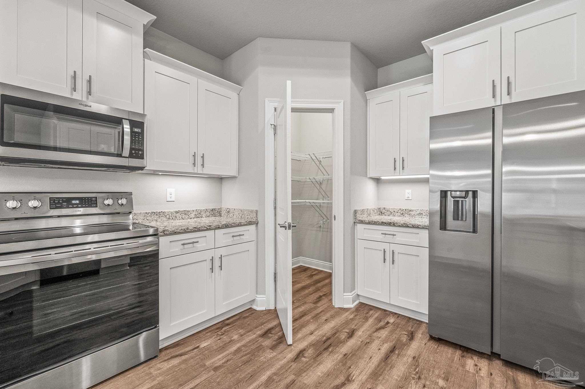 7279 Gordon Evans Road Navarre, FL 32566 - Photo 18 of 40 In view is new stainless refrigerator