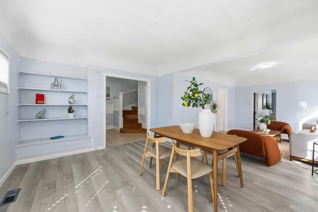 a dining room with furniture and window