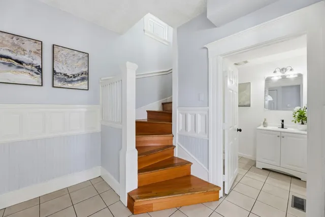 a view of a hallway with kitchen and entryway