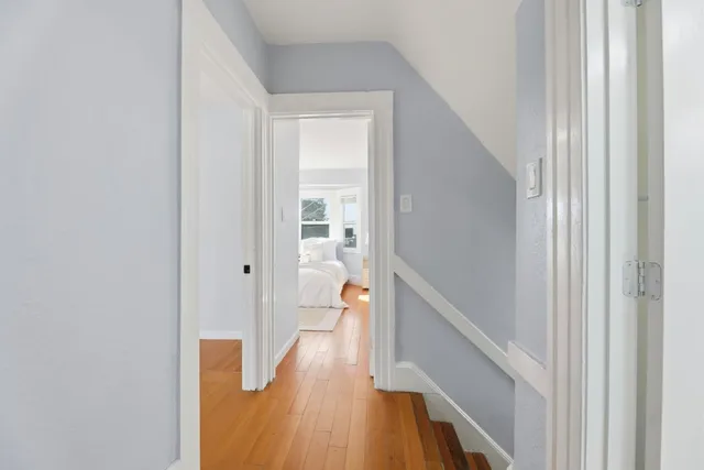 a hallway with wooden floor seating