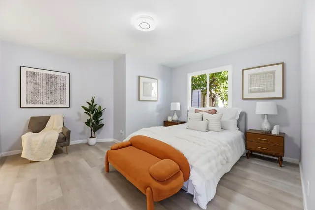 a bedroom with a bed and a couch