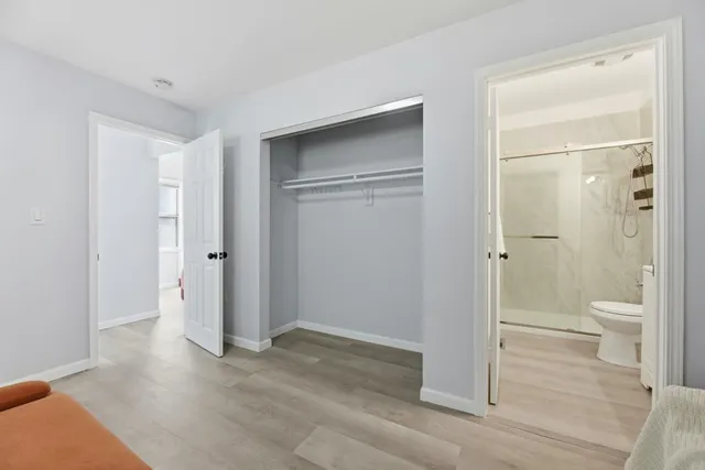 a bathroom with a shower and a toilet