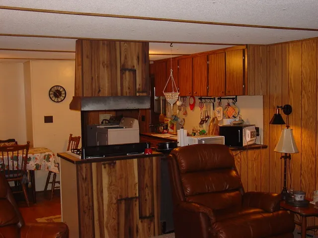 a view of kitchen with furniture and a window
