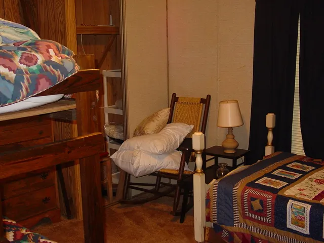 a view of a chairs and table in the balcony