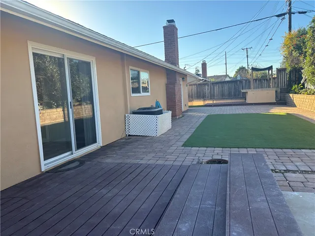 a view of a backyard with sitting area