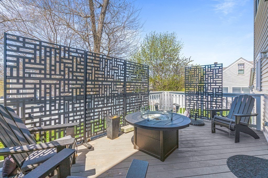 5 Fairview Road Framingham, MA 01702 - Photo 15 of 36 a view of a patio with a table and chairs