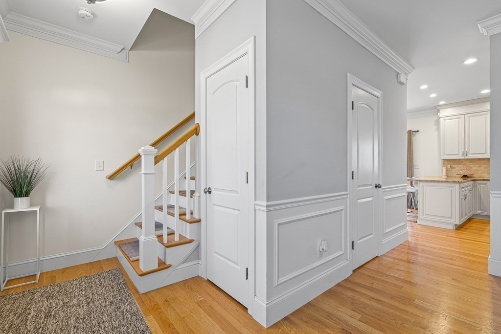 5 Fairview Road Framingham, MA 01702 - Photo 17 of 36 a view of a hallway view with wooden floor and staircase