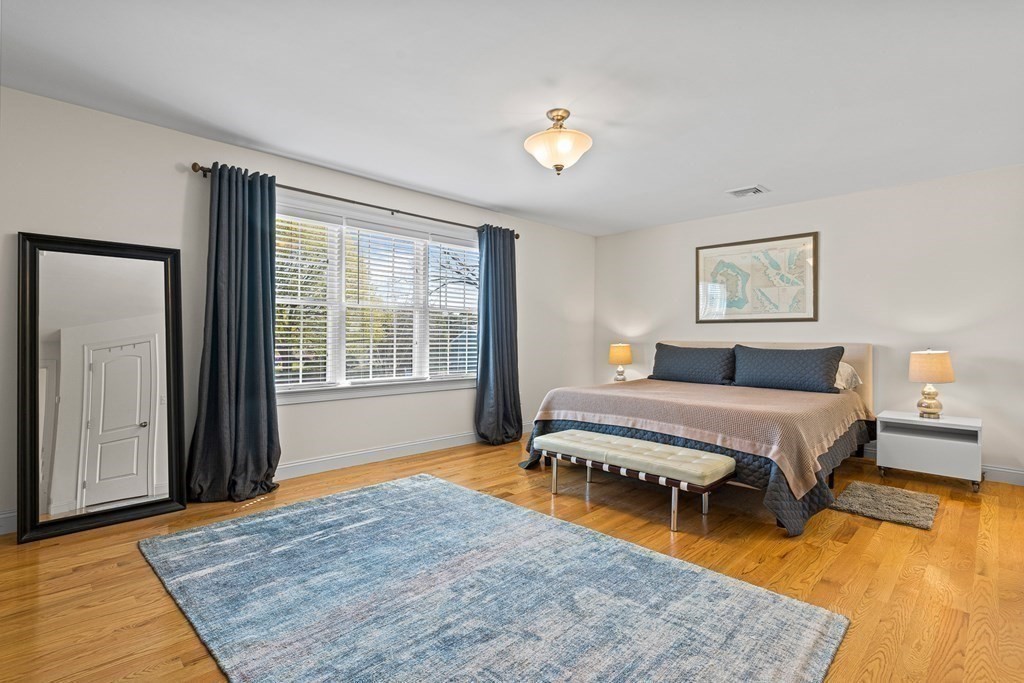 5 Fairview Road Framingham, MA 01702 - Photo 18 of 36 a spacious bedroom with a bed and a window