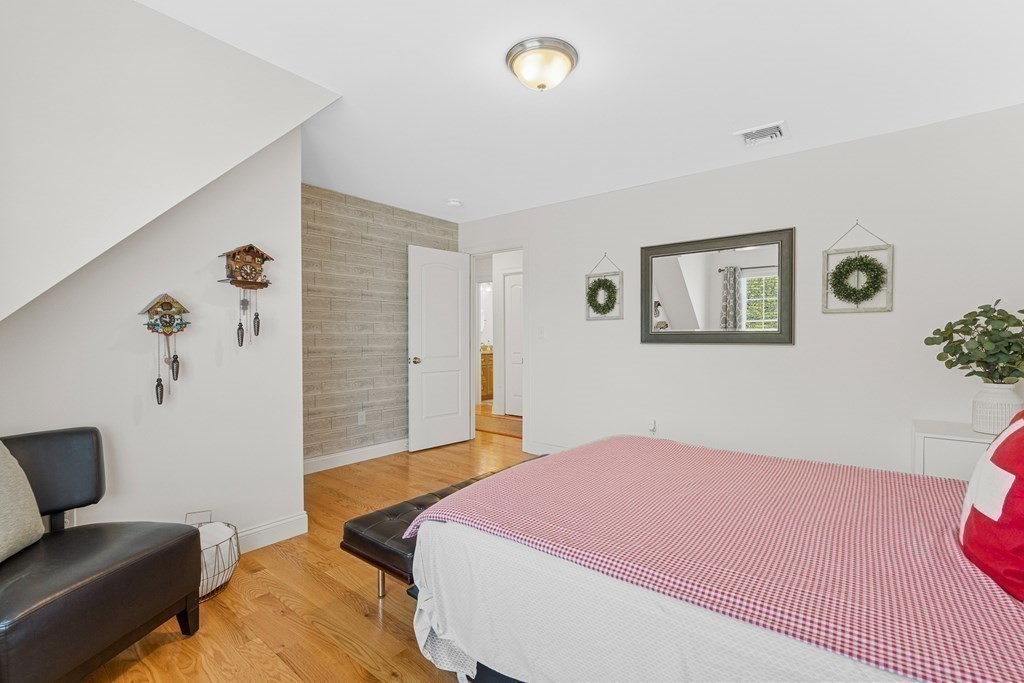 5 Fairview Road Framingham, MA 01702 - Photo 23 of 36 a bedroom with a bed and a couch