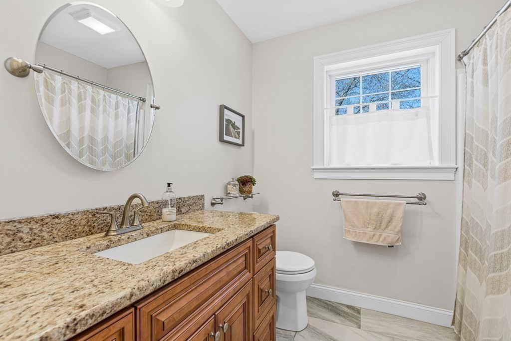 5 Fairview Road Framingham, MA 01702 - Photo 26 of 36 a bathroom with a granite countertop sink and a mirror