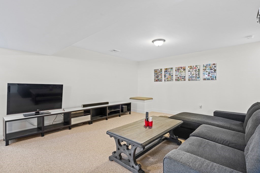 5 Fairview Road Framingham, MA 01702 - Photo 28 of 36 a living room with furniture and a flat screen tv