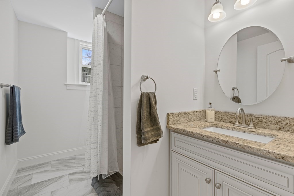 5 Fairview Road Framingham, MA 01702 - Photo 31 of 36 a bathroom with a granite countertop sink and a mirror