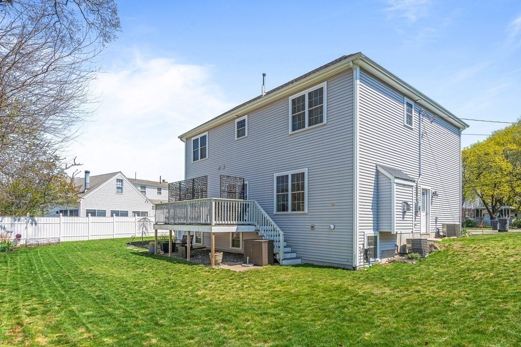 5 Fairview Road Framingham, MA 01702 - Photo 35 of 36 a big white house with a small yard and more windows