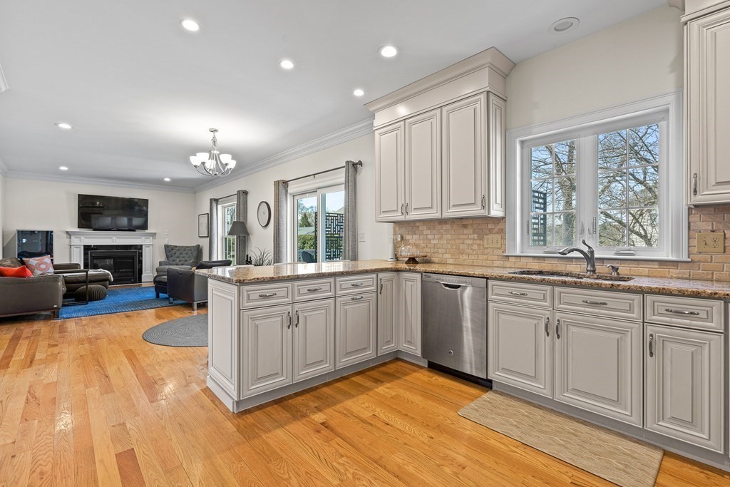 5 Fairview Road Framingham, MA 01702 - Photo 4 of 36 a kitchen with stainless steel appliances granite countertop a stove sink and cabinets