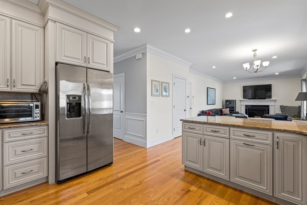 5 Fairview Road Framingham, MA 01702 - Photo 5 of 36 a kitchen with kitchen island granite countertop a refrigerator and a sink