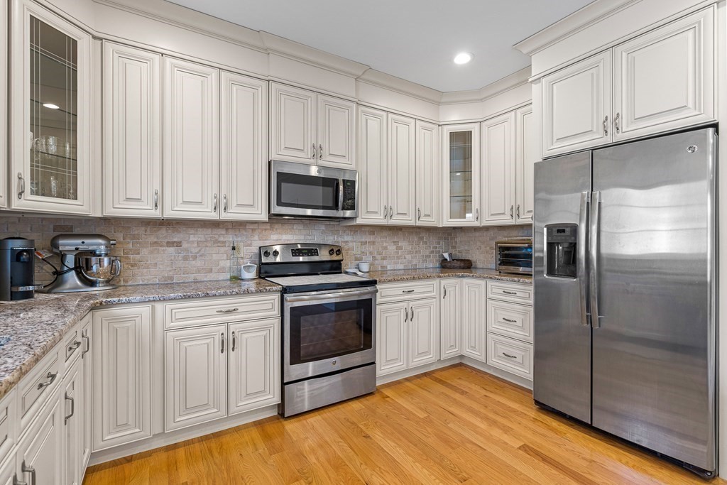 5 Fairview Road Framingham, MA 01702 - Photo 6 of 36 a kitchen with stainless steel appliances granite countertop a stove a sink and a refrigerator