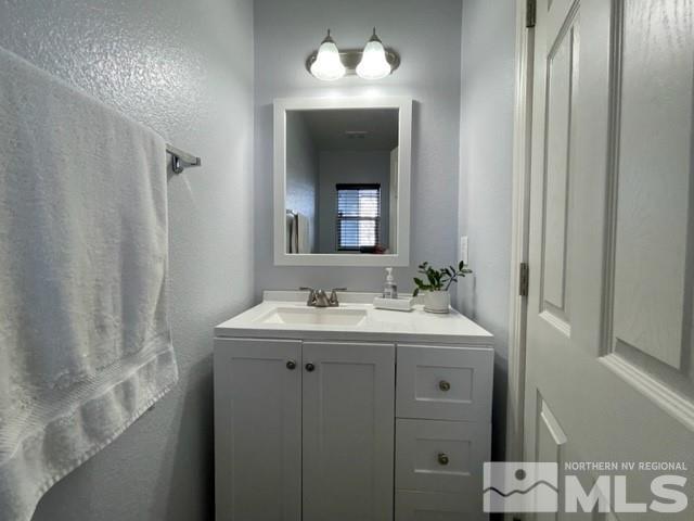 2115 Stanhope Lane Reno, NV 89502 - Photo 11 of 15 a bathroom with a sink and a mirror with toilet