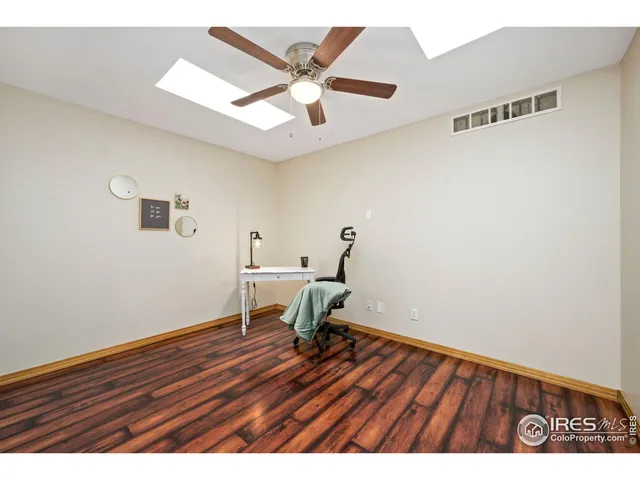 a view of room with wooden floor