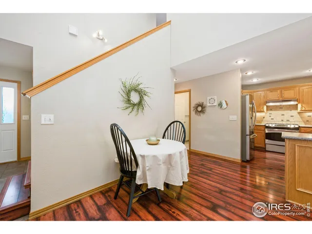 a view of a dining room with furniture and a wooden floor