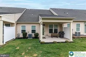 a view of house with backyard porch and furniture