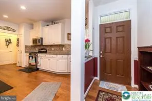 a kitchen with stainless steel appliances granite countertop a refrigerator and a stove