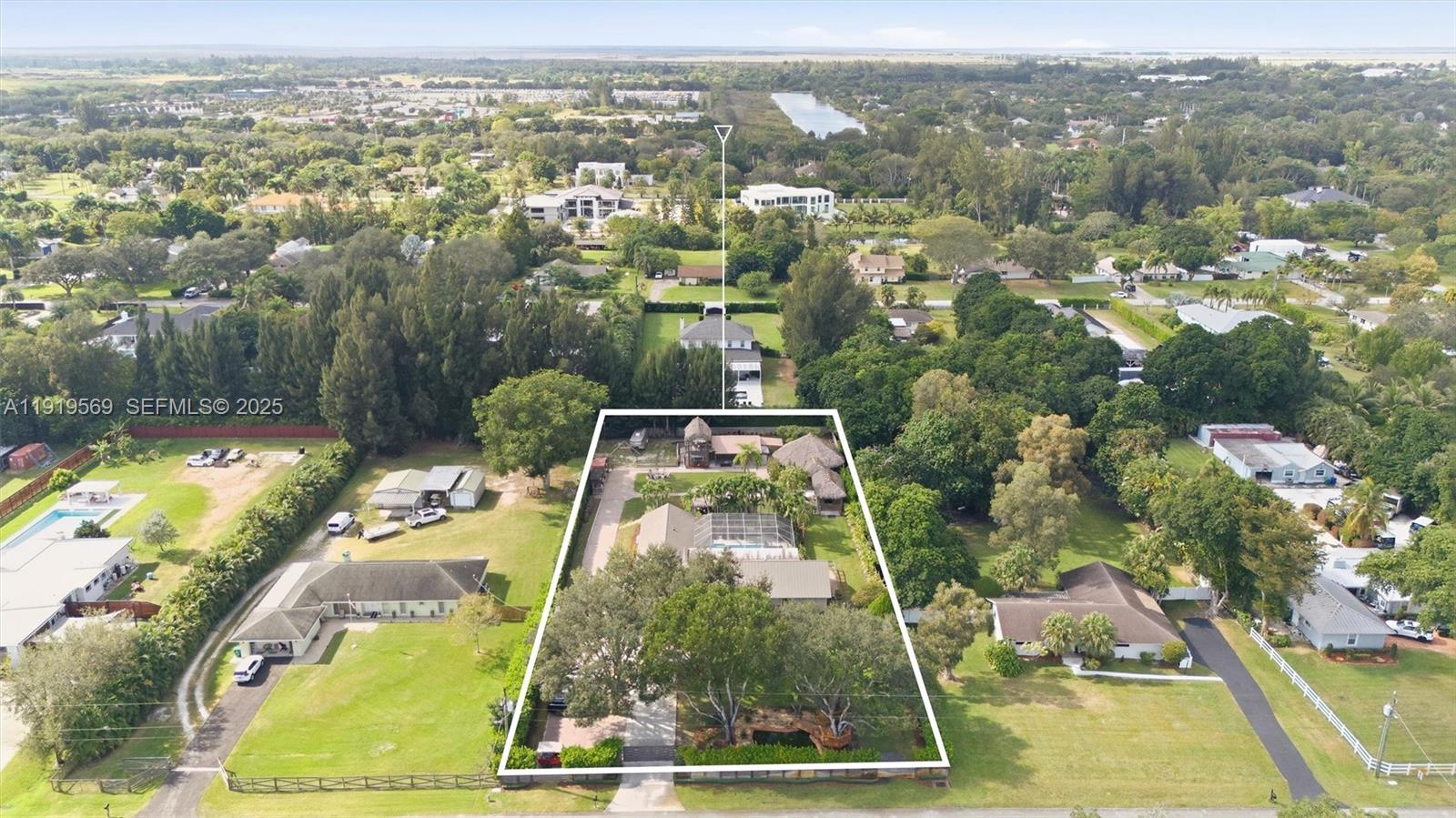 an aerial view of a residential houses with outdoor space