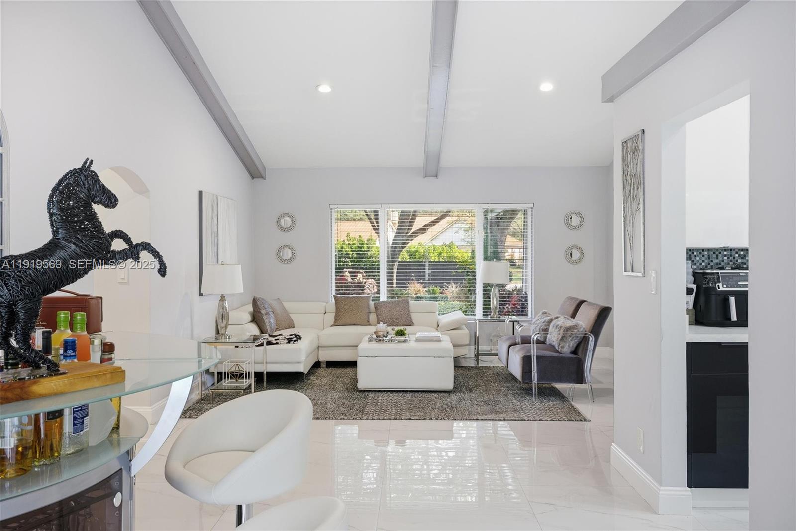 5601 Southwest 195th Terrace Southwest Ranches, FL 33332 - Photo 15 of 84 a living room with furniture and a large window