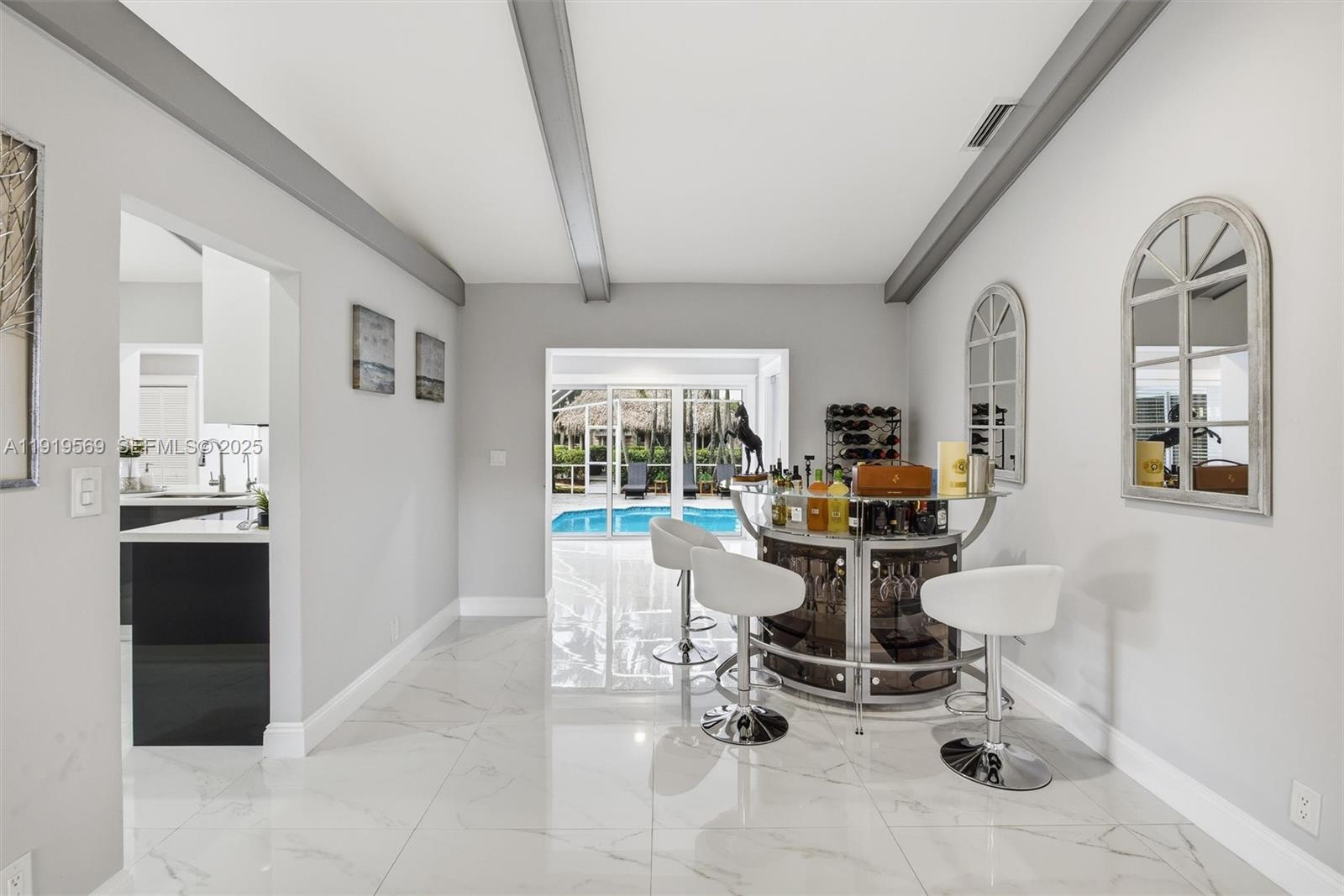 5601 Southwest 195th Terrace Southwest Ranches, FL 33332 - Photo 16 of 84 a view of a living room and dining room