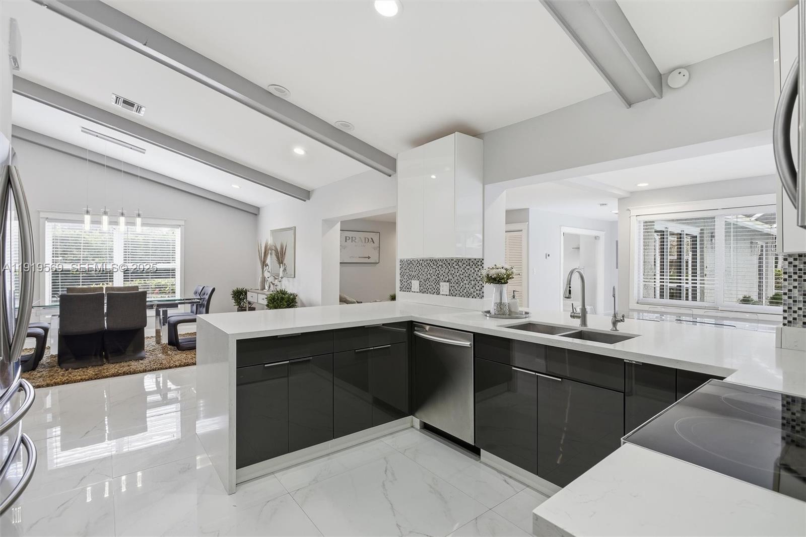5601 Southwest 195th Terrace Southwest Ranches, FL 33332 - Photo 17 of 84 a large kitchen with a sink and cabinets