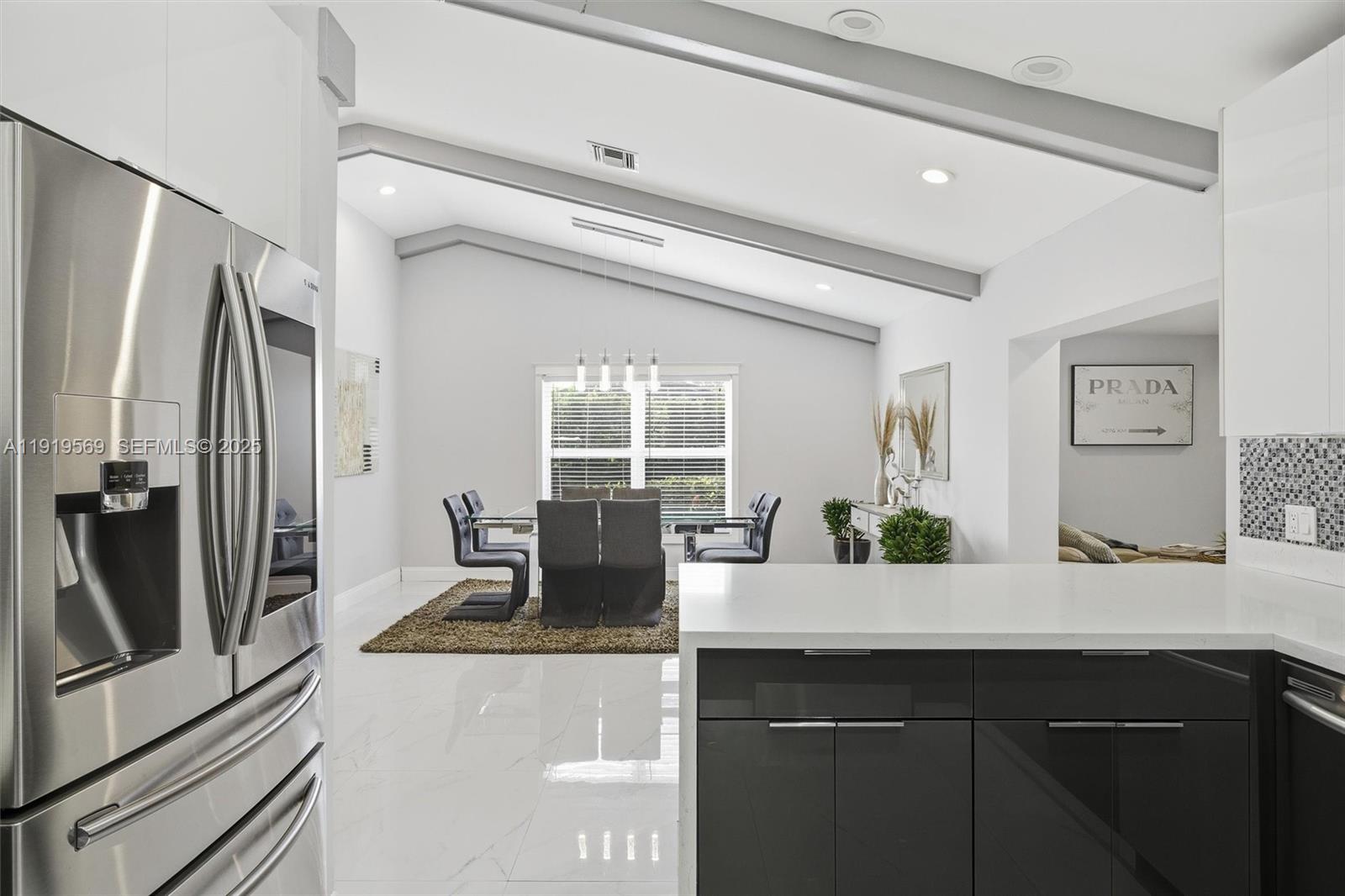 5601 Southwest 195th Terrace Southwest Ranches, FL 33332 - Photo 18 of 84 a kitchen with a sink and refrigerator