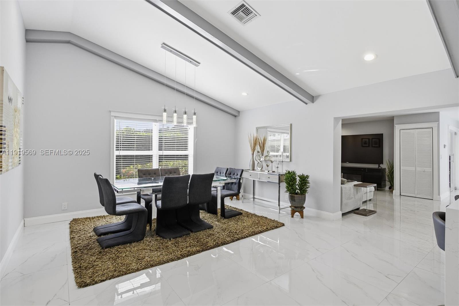 5601 Southwest 195th Terrace Southwest Ranches, FL 33332 - Photo 19 of 84 a living room with furniture and large windows
