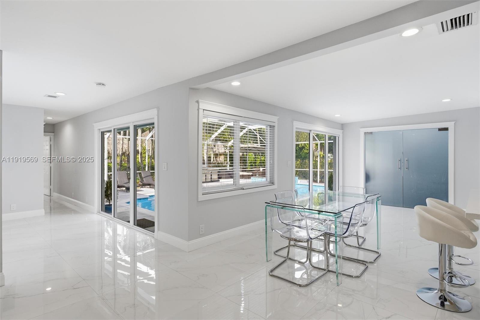 5601 Southwest 195th Terrace Southwest Ranches, FL 33332 - Photo 22 of 84 a view of a livingroom with furniture and windows