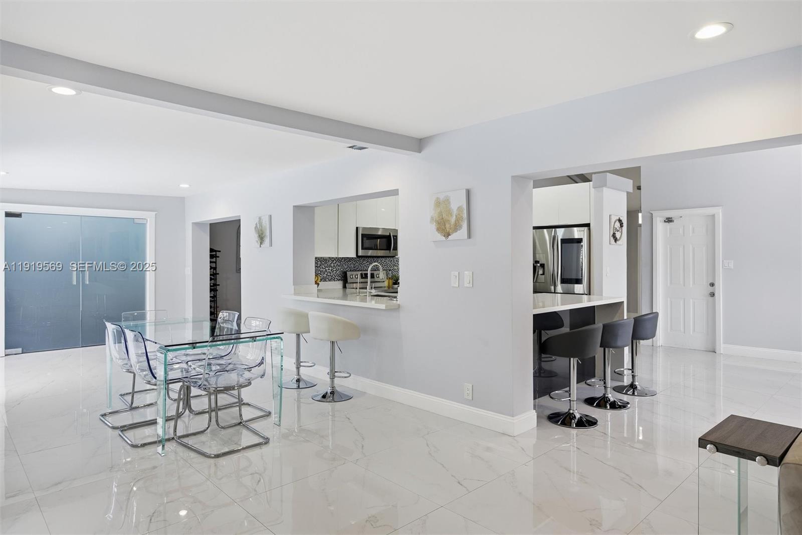 5601 Southwest 195th Terrace Southwest Ranches, FL 33332 - Photo 23 of 84 a dining room with furniture and view of kitchen